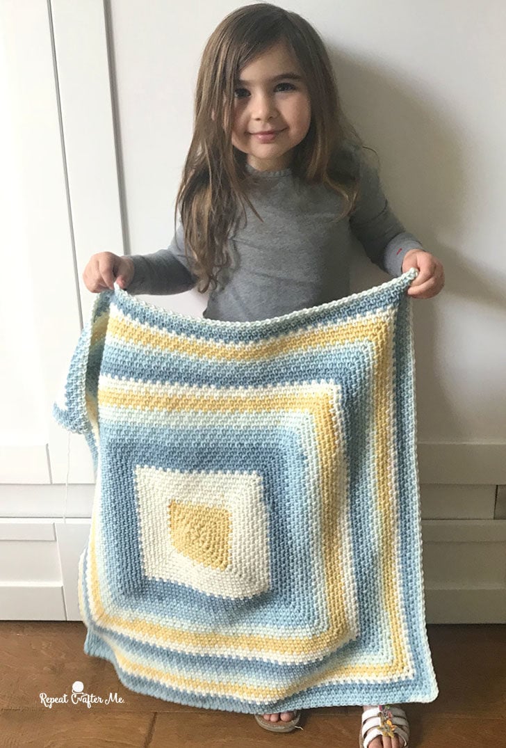 Designed by Sarah Zimmerman of Repeat Crafter Me, the Moss Stitch in a Square Blanket is an easy crochet project you can make with Caron Big Cakes Yarn and a 5 mm (H) crochet hook. The free written pattern is available on her site and you can watch a video tutorial for the stitch here.