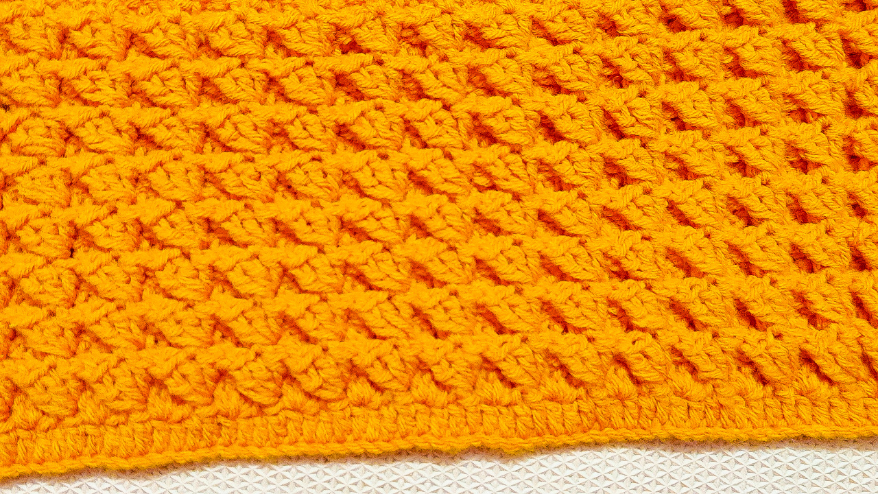 Learn how to make a Pumpkin Stretch Crochet Blanket with the free pattern and tutorial from Raji's Craft Hobby.