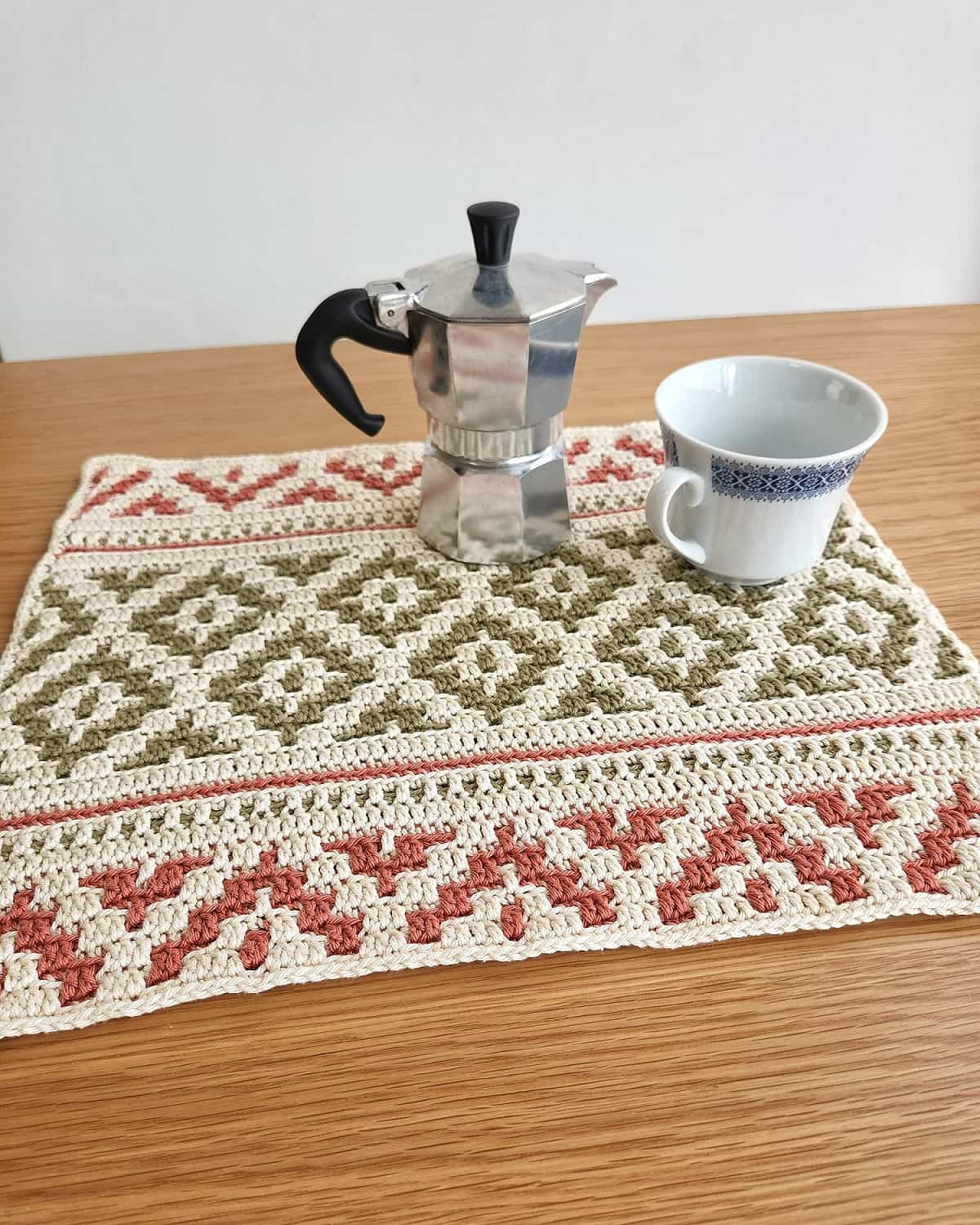 The Bohemian Mosaic crochet rectangle placemat pattern is made using the overlay mosaic crochet method and is an intermediate skill level.