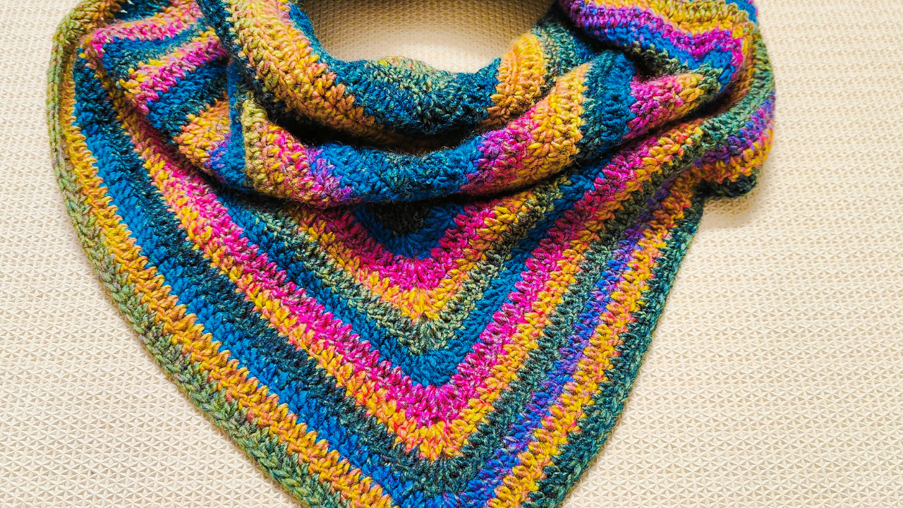 Here is a pattern for a very Easy and Simple Crochet Triangle Shawl. Use cake yarn for this project to have a colorful shawl without the hassle of changing colors.