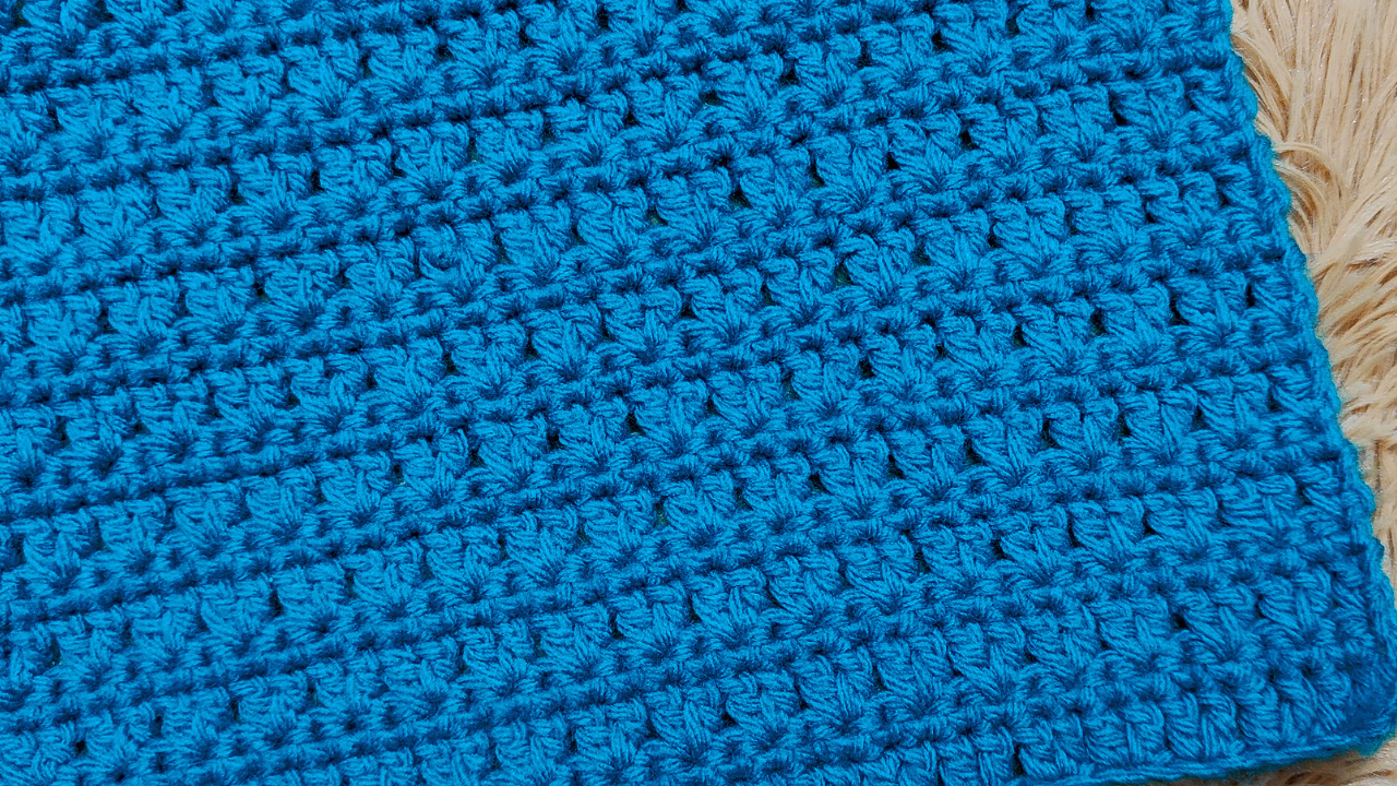 Today's crochet blanket pattern alternates a row of double crochet stitches with a row of single crochet stitches. You can alter the size of the blanket by changing the number of starting chains.