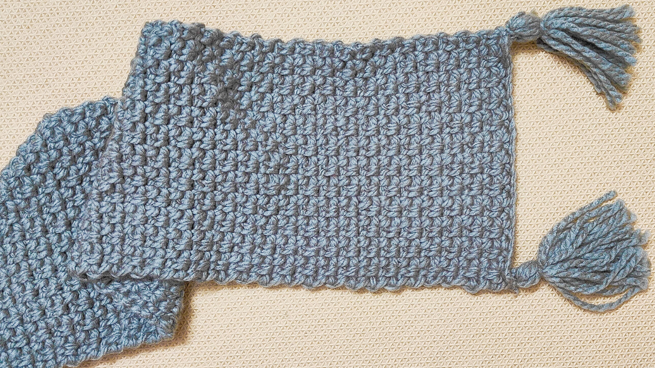 This pattern demonstrates how easy it is to create a beautiful crochet scarf using the moss stitch.