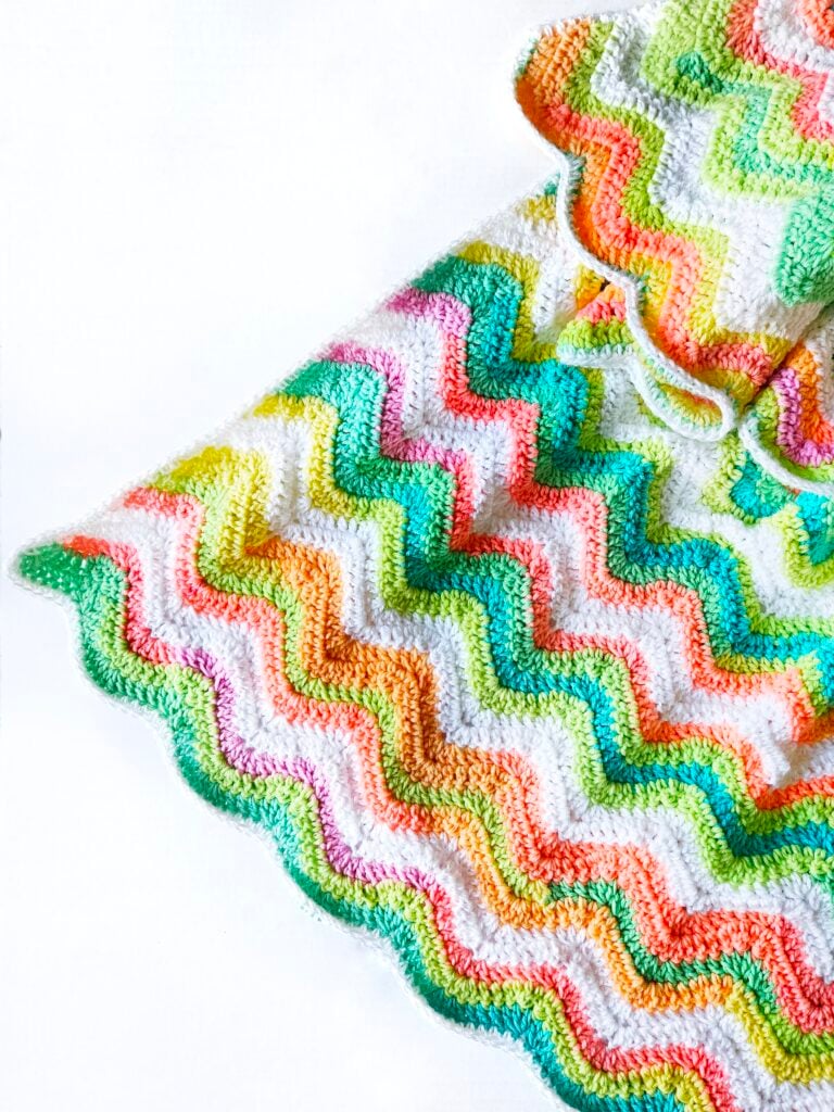 Crochet a rainbow ripple blanket with this free afghan pattern from Krista Cagle.