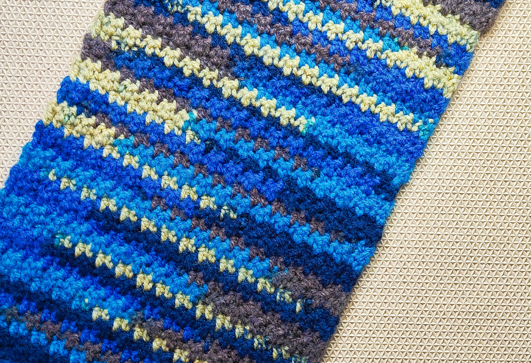 Learn how easy it is to crochet this scarf with the griddle stitch. Along with a free crochet pattern, Raji's Craft Hobby has provided a step-by-step video tutorial to help you learn how to make the stitch. This is a beginner level crochet stitch and uses only basic crochet stitches; sc and dc.