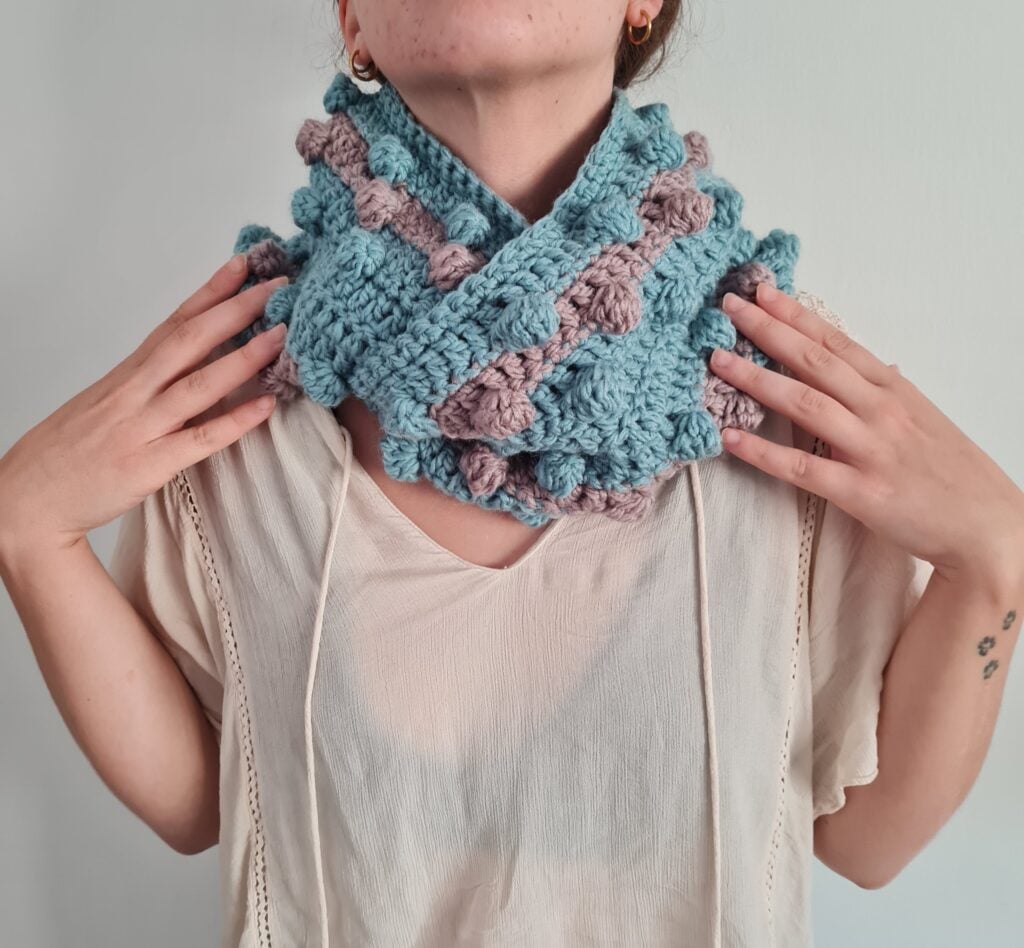 Learn how to create a versatile infinity scarf with this versatile pattern. You can use as many, or as few colors as you wish to make it the perfect accessory for all outfits. Transform your finished project into a cowl or leave it open for a lovely crochet scarf.
