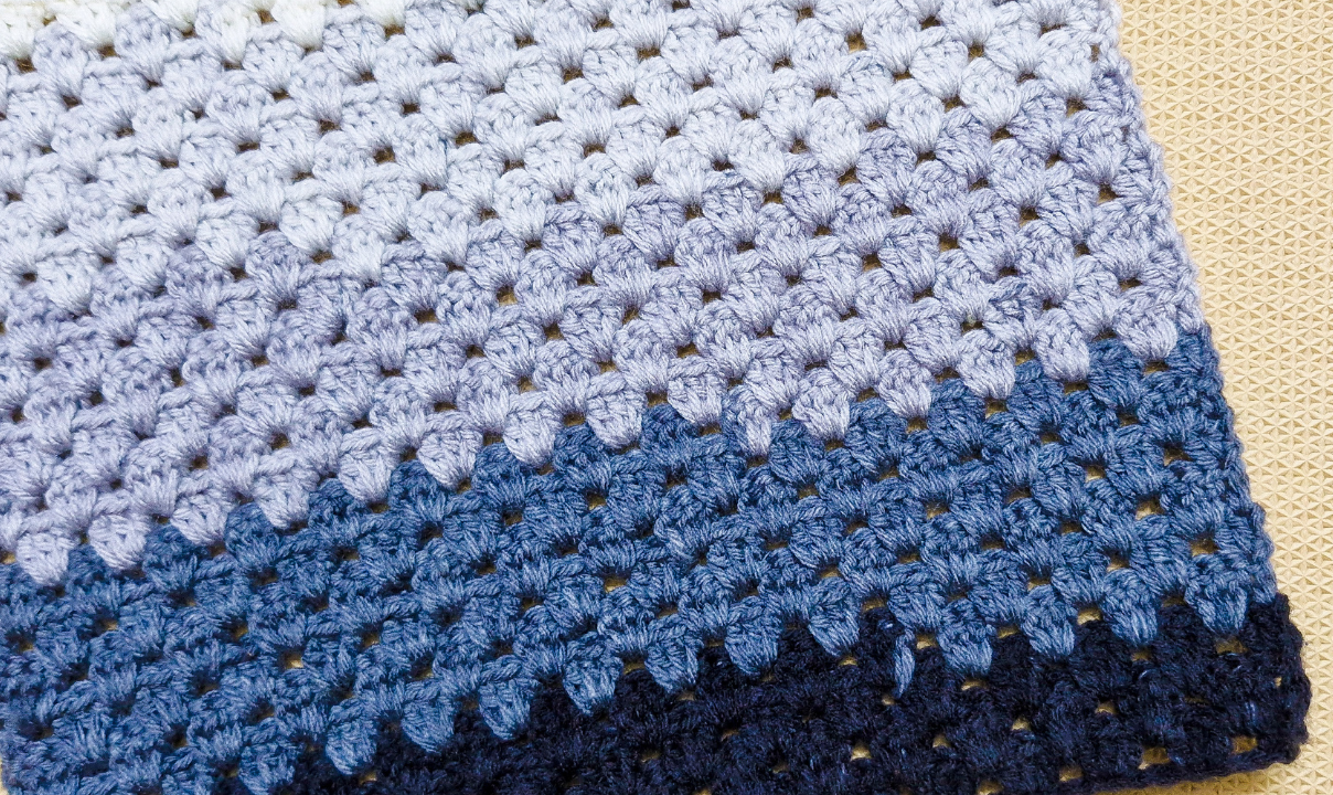 Crochet a colorful granny stripe blanket with this free tutorial and video. Simple stitches, easy rows, and perfect for gifts or relaxing weekends. Save it for later!