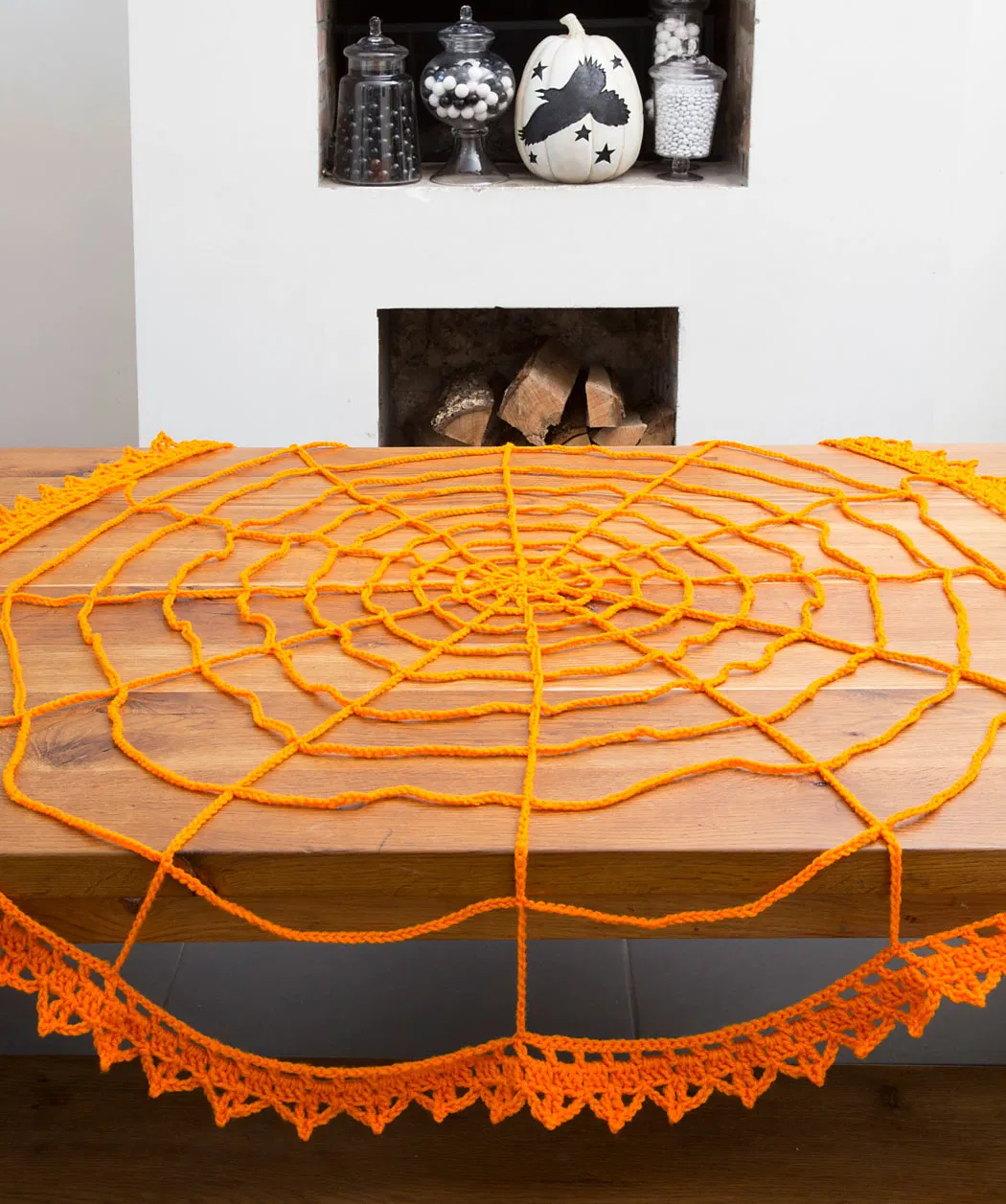 Designed by Jessie Rayot for Yarnspirations, this super easy and quick Spider Web Table Topper was made with Aran Weight Yarn [4] and a 5.5 mm (I) crochet hook. When complete it measures approximately 54 inches in diameter. A perfect table decoration for Halloween!