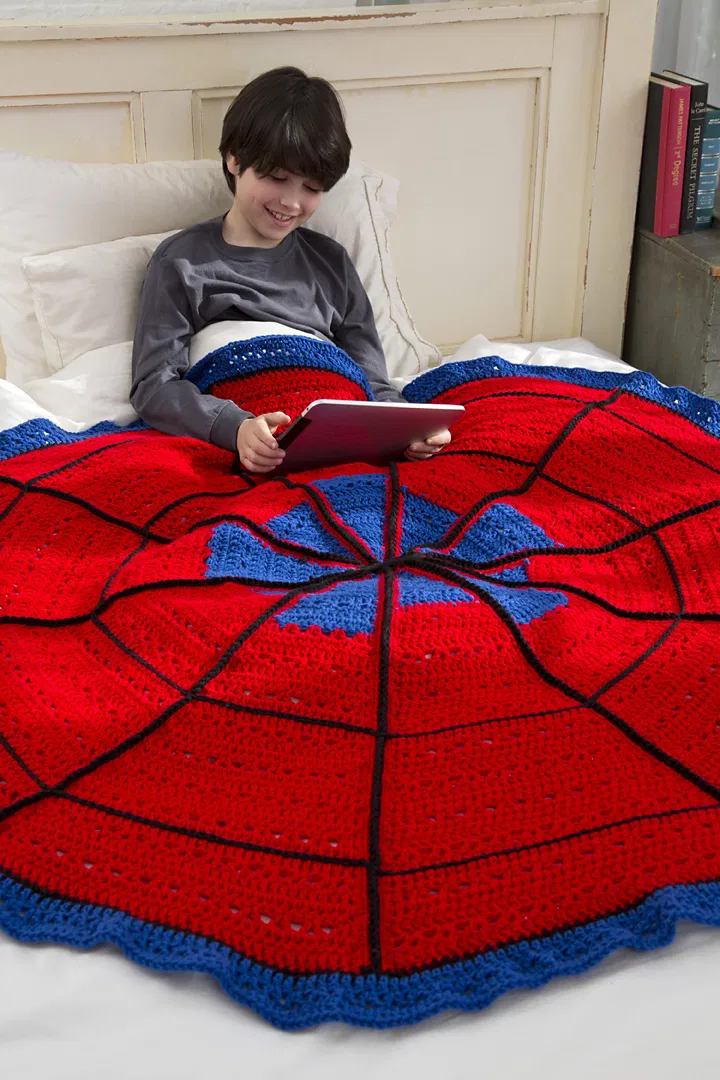 Designed by Ellen Gormley for Red Heart Yarn, the Spider Web Throw was made with Worsted Weight Yarn [4] and a 6.5 mm (K) crochet hook. When complete the throw measures 53 inches in diameter. You can download the free pattern from Yarnspirations.