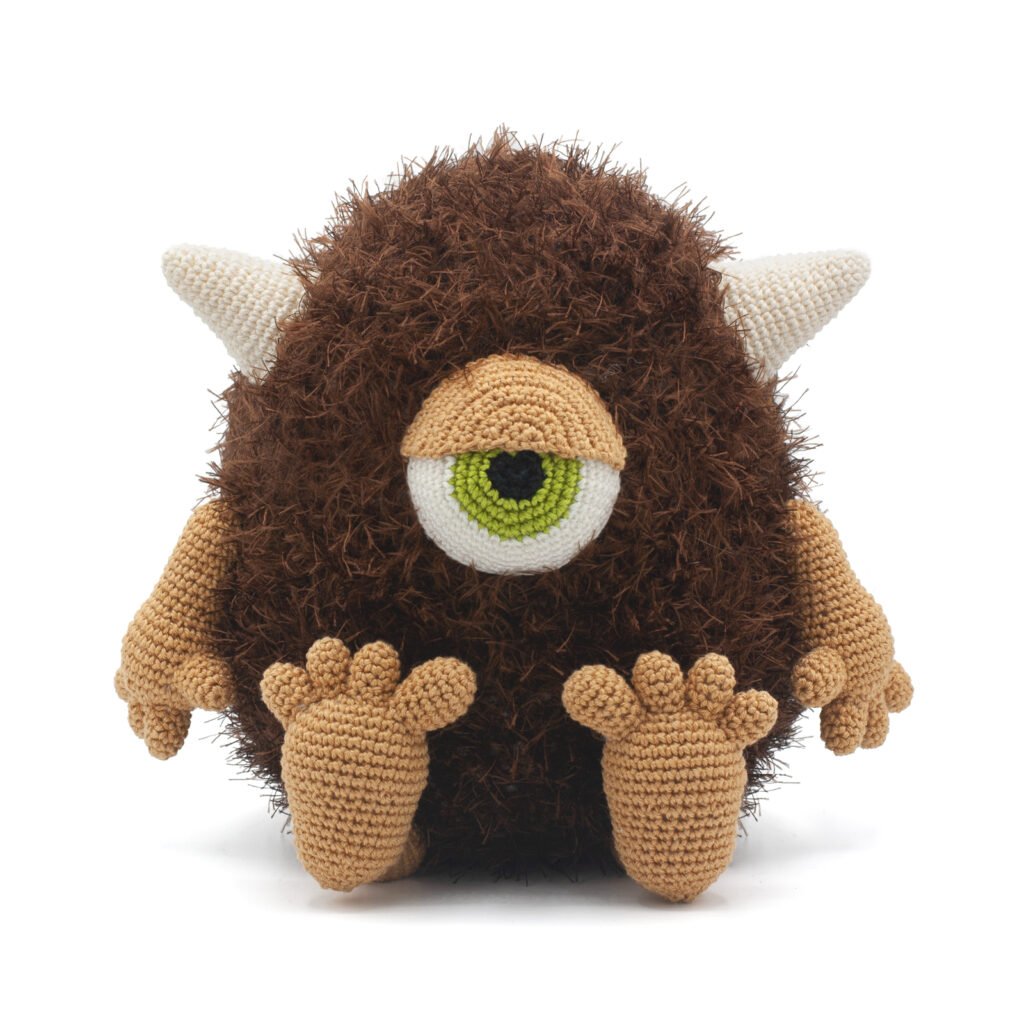 Looking for a fun crochet project? Try making Hector the Cyclops! This one-eyed monster is made with soft furry yarn for his body and sport-weight cotton for his details. He’s cute, easy to make, and sure to be a hit!