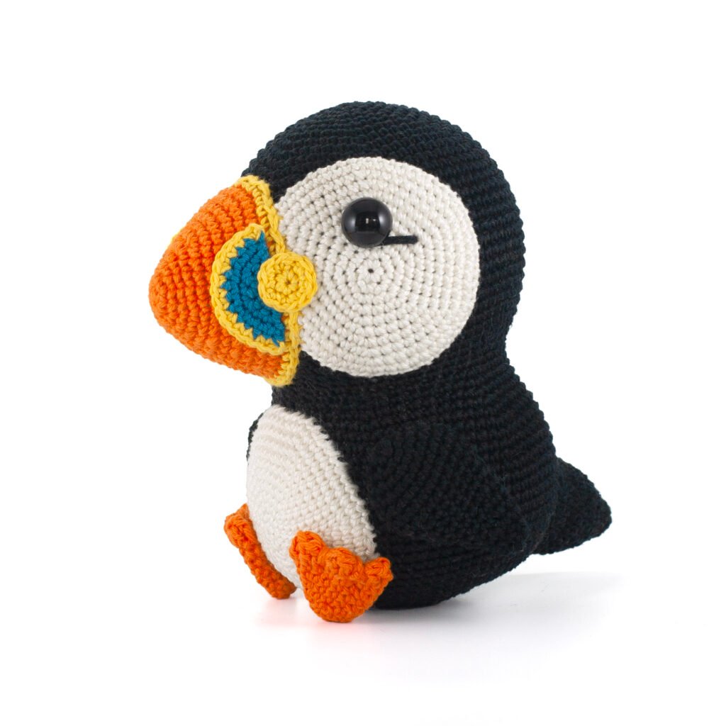 Crochet Molly the Puffin with this free pattern by Mariska Vos. A sweet beginner-friendly amigurumi you can make in any size. #puffincrochet #amigurumi #freecrochettutorials #crochetpattern #diyfluffies